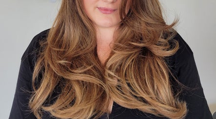 Bouncy, layered hair styling at Gareth at MITI BEAUTY in Bristol, England, GB.