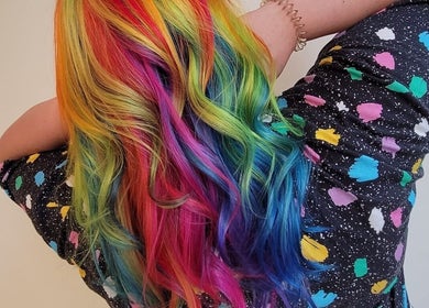 Colorful rainbow hair transformation at Gareth at MITI BEAUTY in Bristol, England, GB.