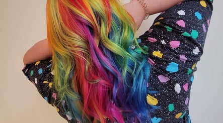 Colorful rainbow hair transformation at Gareth at MITI BEAUTY in Bristol, England, GB.