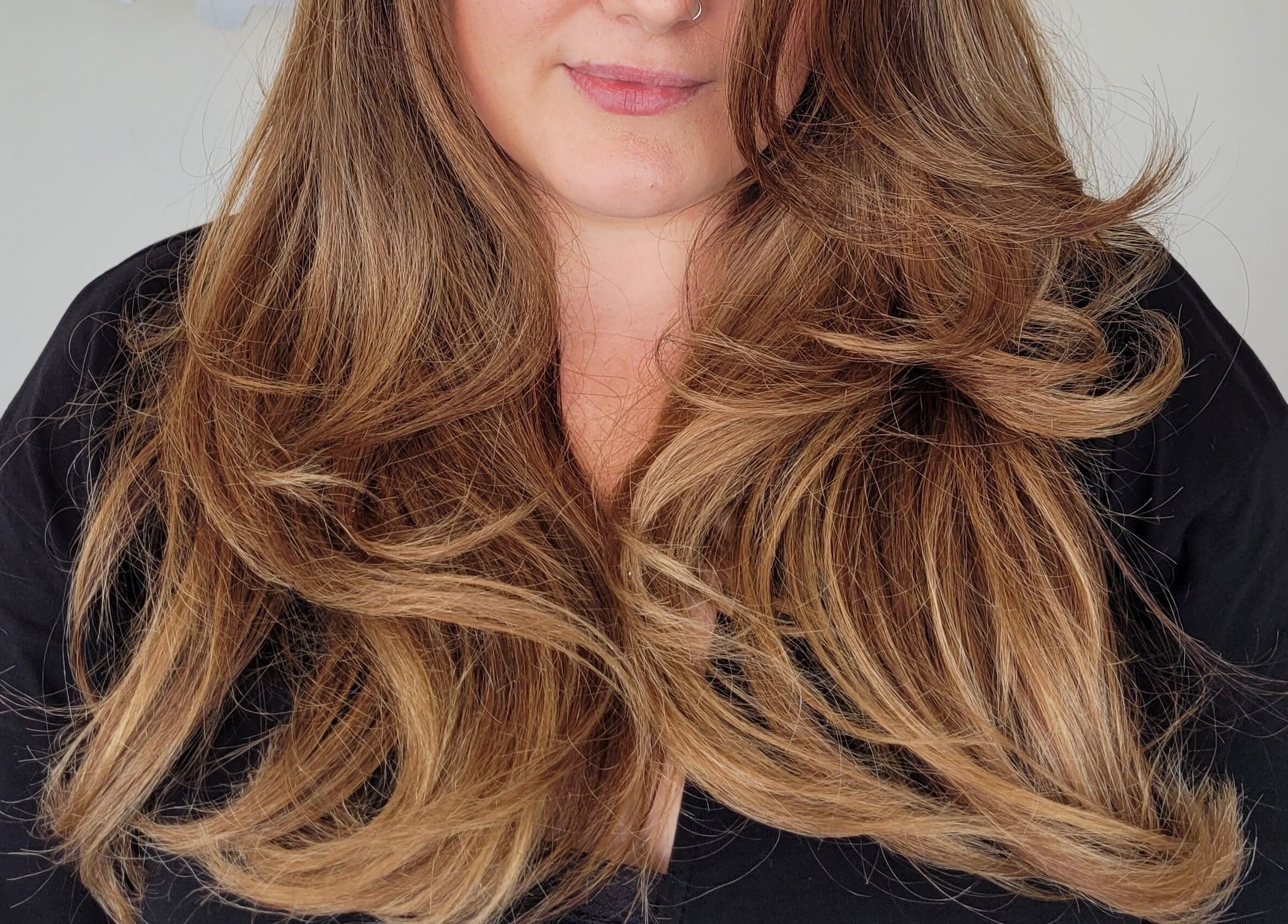 Stylish long layered hair styled at Gareth at The Loft Hair Studio in Bristol, England, GB.