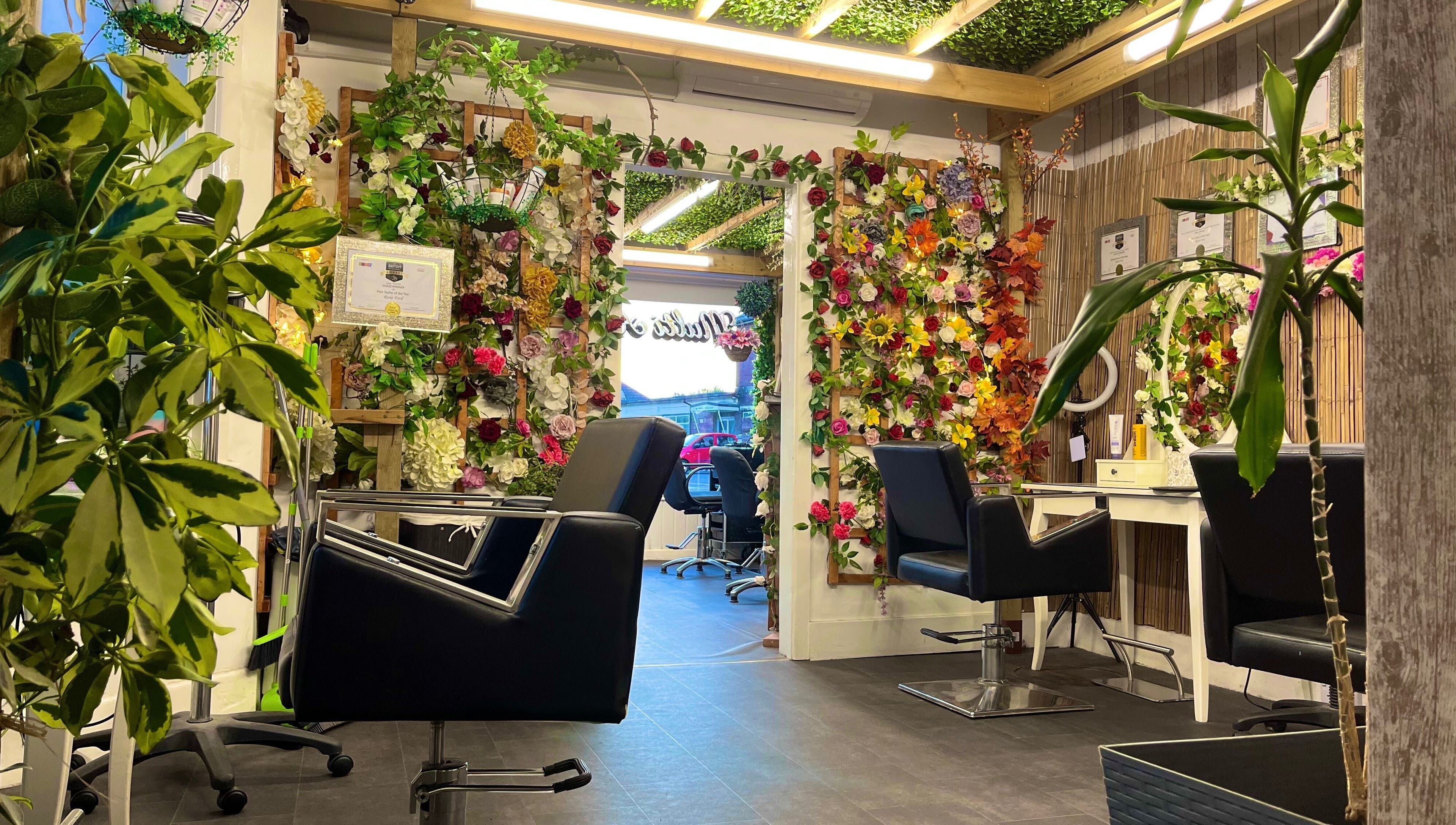Stylish interior of Redlocks Hair in Bournemouth, England, GB, adorned with vibrant floral decor.