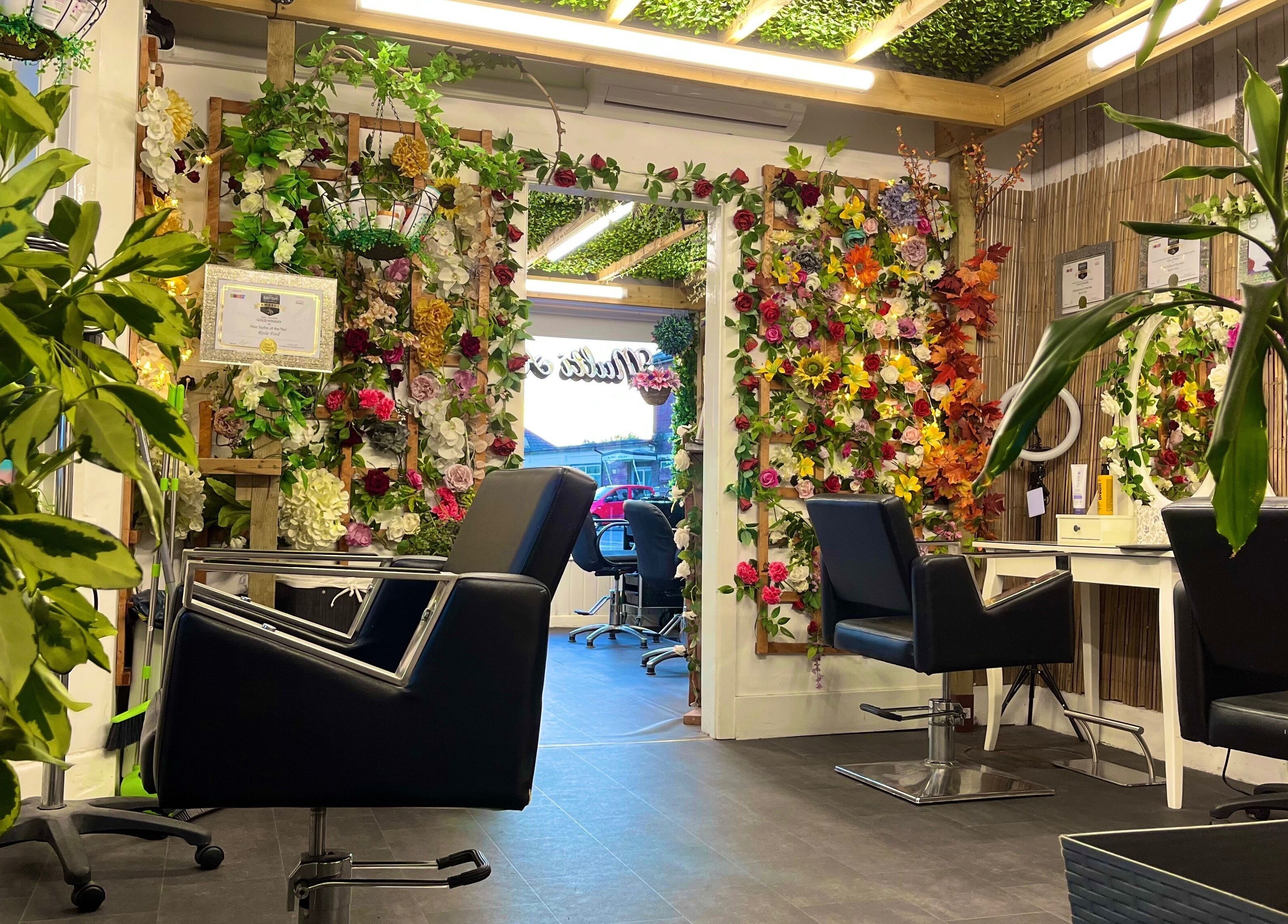 Stylish interior of Redlocks Hair in Bournemouth, England, GB, adorned with vibrant floral decor.