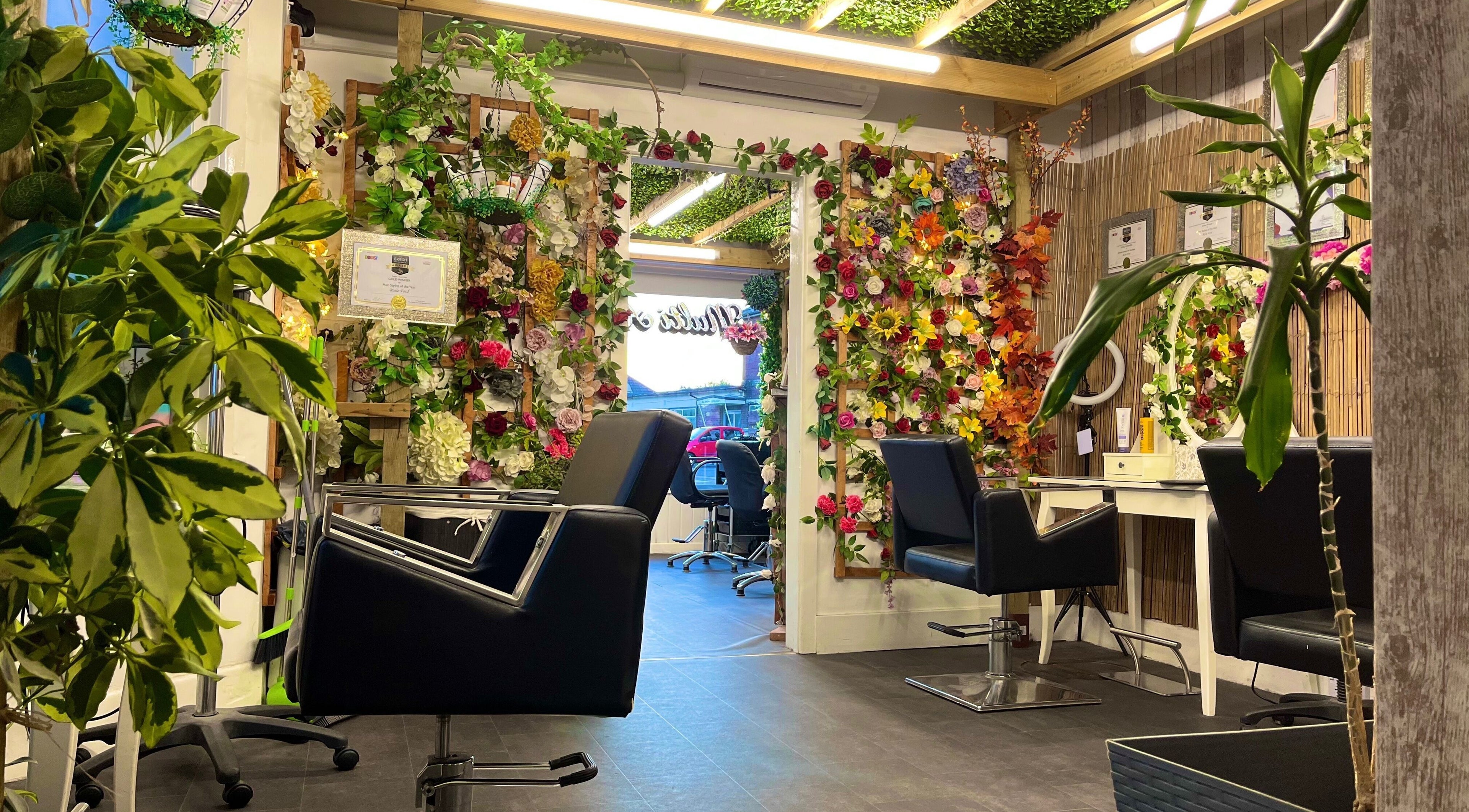 Stylish interior of Redlocks Hair in Bournemouth, England, GB, adorned with vibrant floral decor.