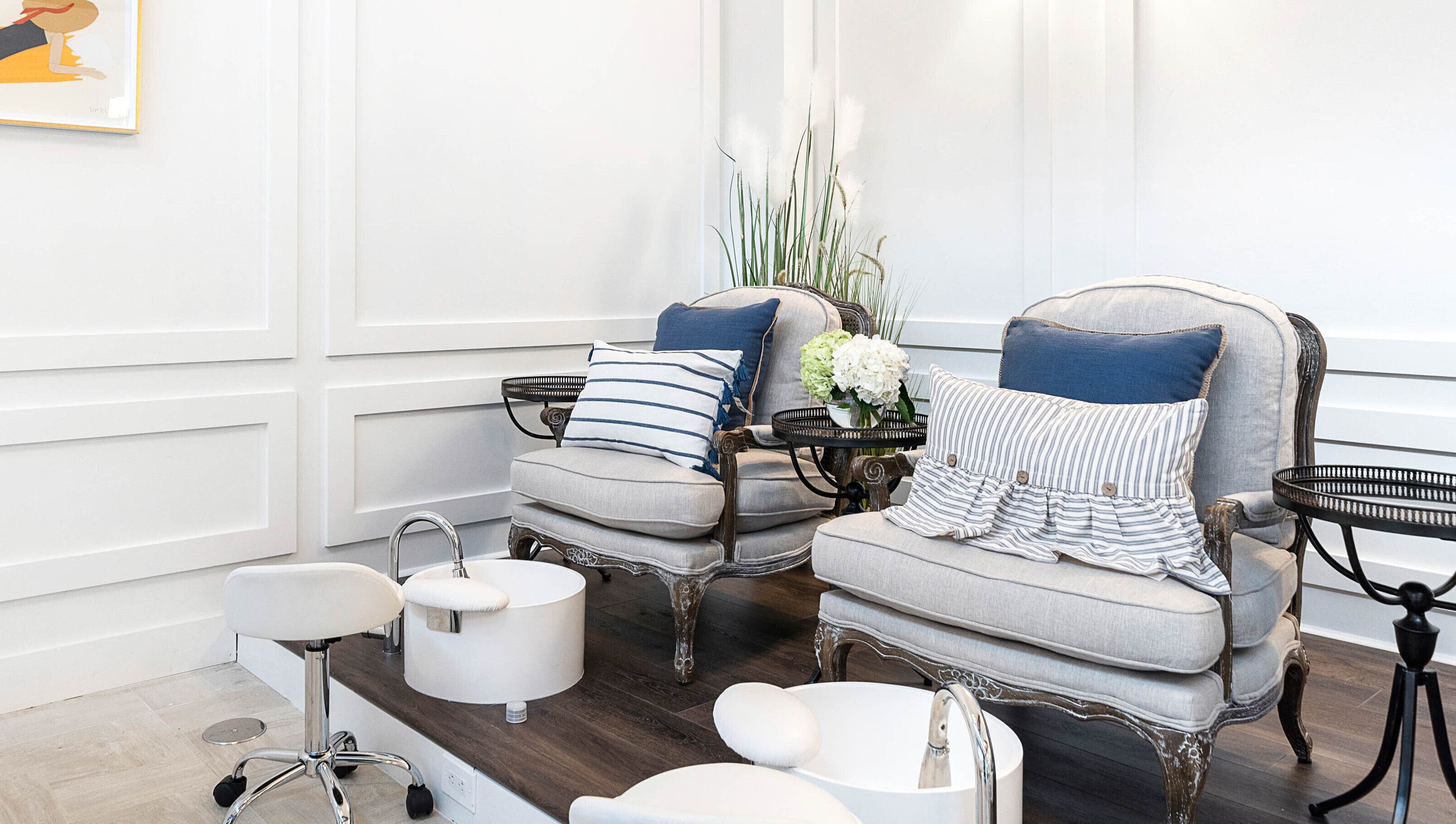 Luxurious pedicure station at Sojourn De Nails in Houston, Texas, US featuring plush seating and stylish decor.