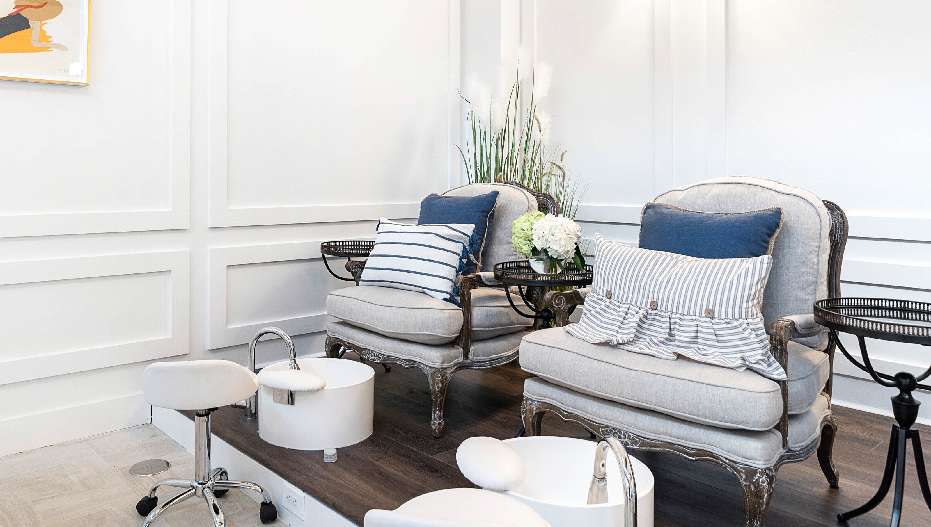 Luxurious pedicure station at Sojourn De Nails in Houston, Texas, US featuring plush seating and stylish decor.