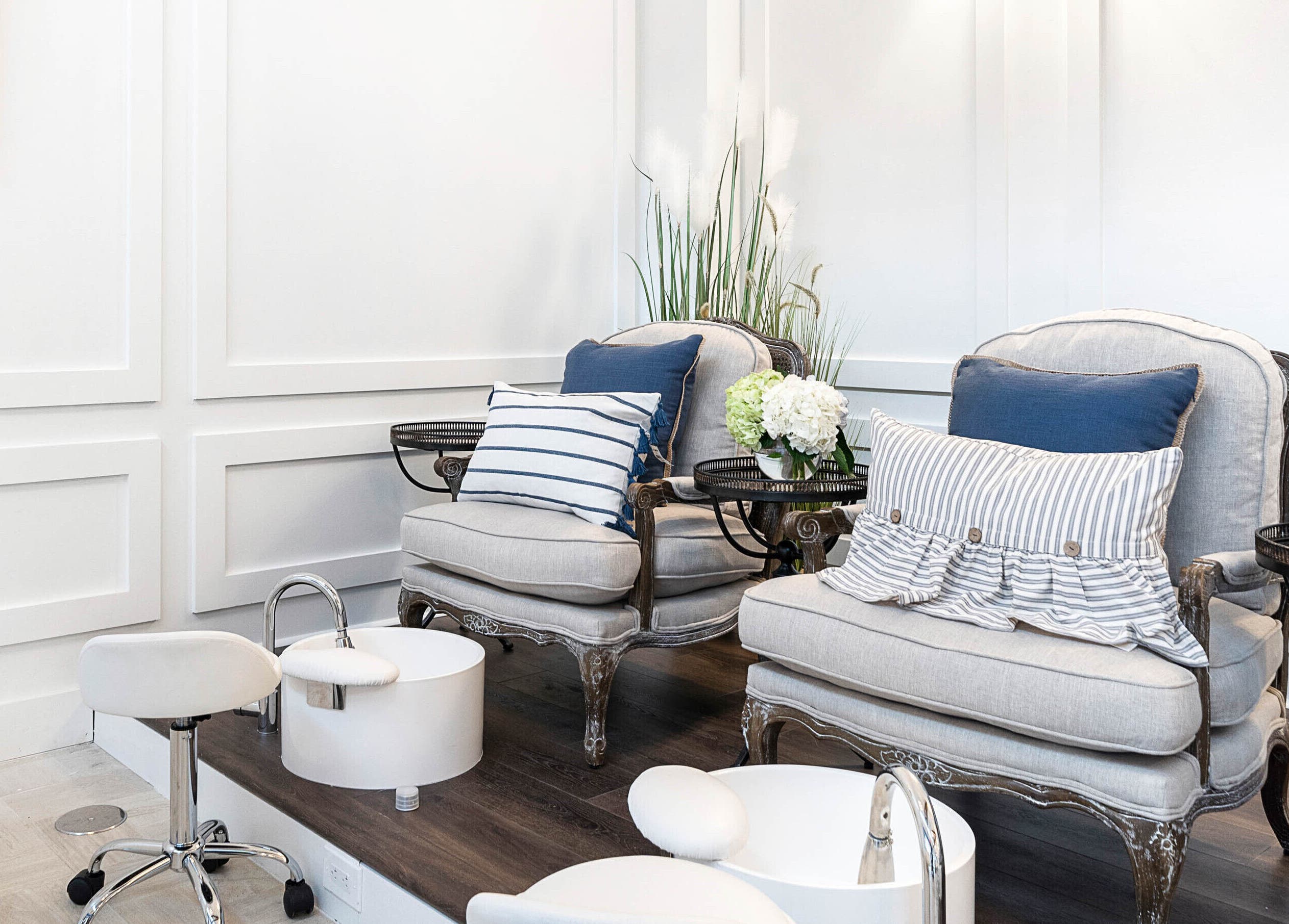 Luxurious pedicure station at Sojourn De Nails in Houston, Texas, US featuring plush seating and stylish decor.