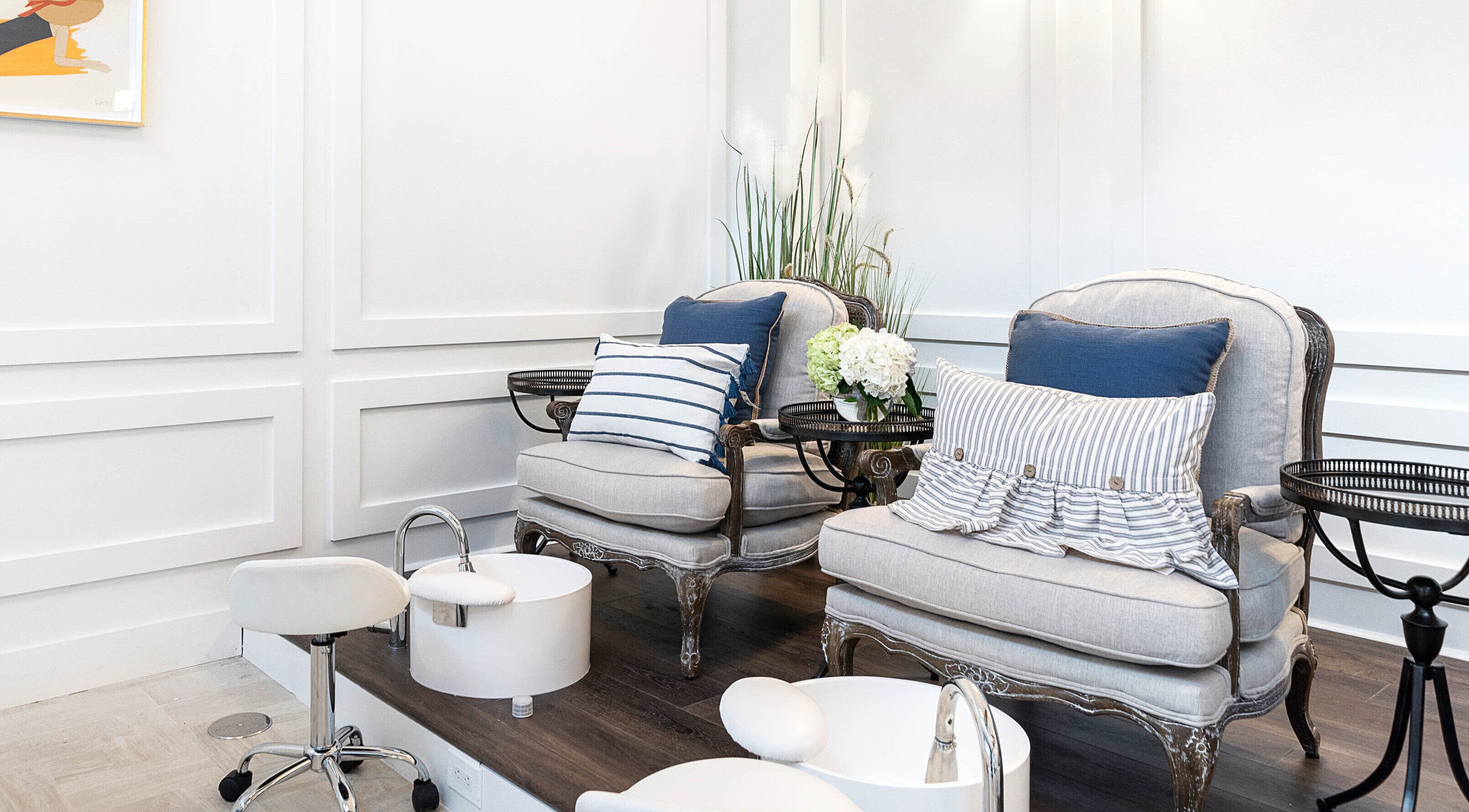Luxurious pedicure station at Sojourn De Nails in Houston, Texas, US featuring plush seating and stylish decor.