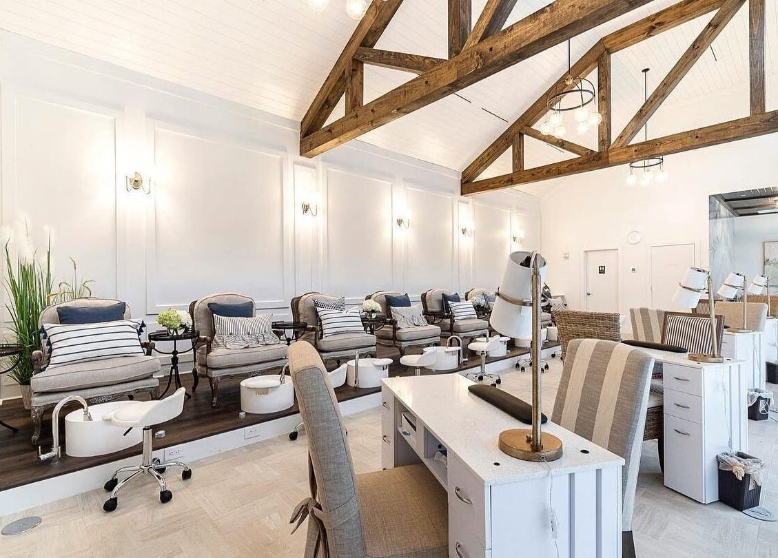 Elegant interior of Sojourn De Nails in Houston, Texas, US featuring plush pedicure chairs and modern decor.