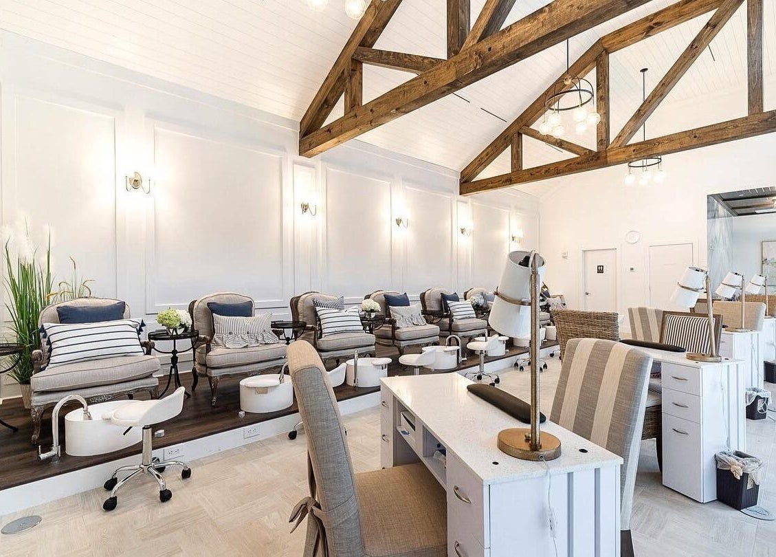 Elegant interior of Sojourn De Nails in Houston, Texas, US featuring plush pedicure chairs and modern decor.