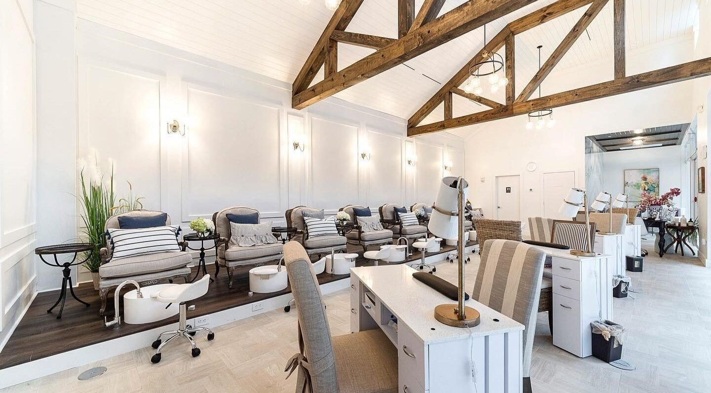 Elegant interior of Sojourn De Nails in Houston, Texas, US featuring plush pedicure chairs and modern decor.