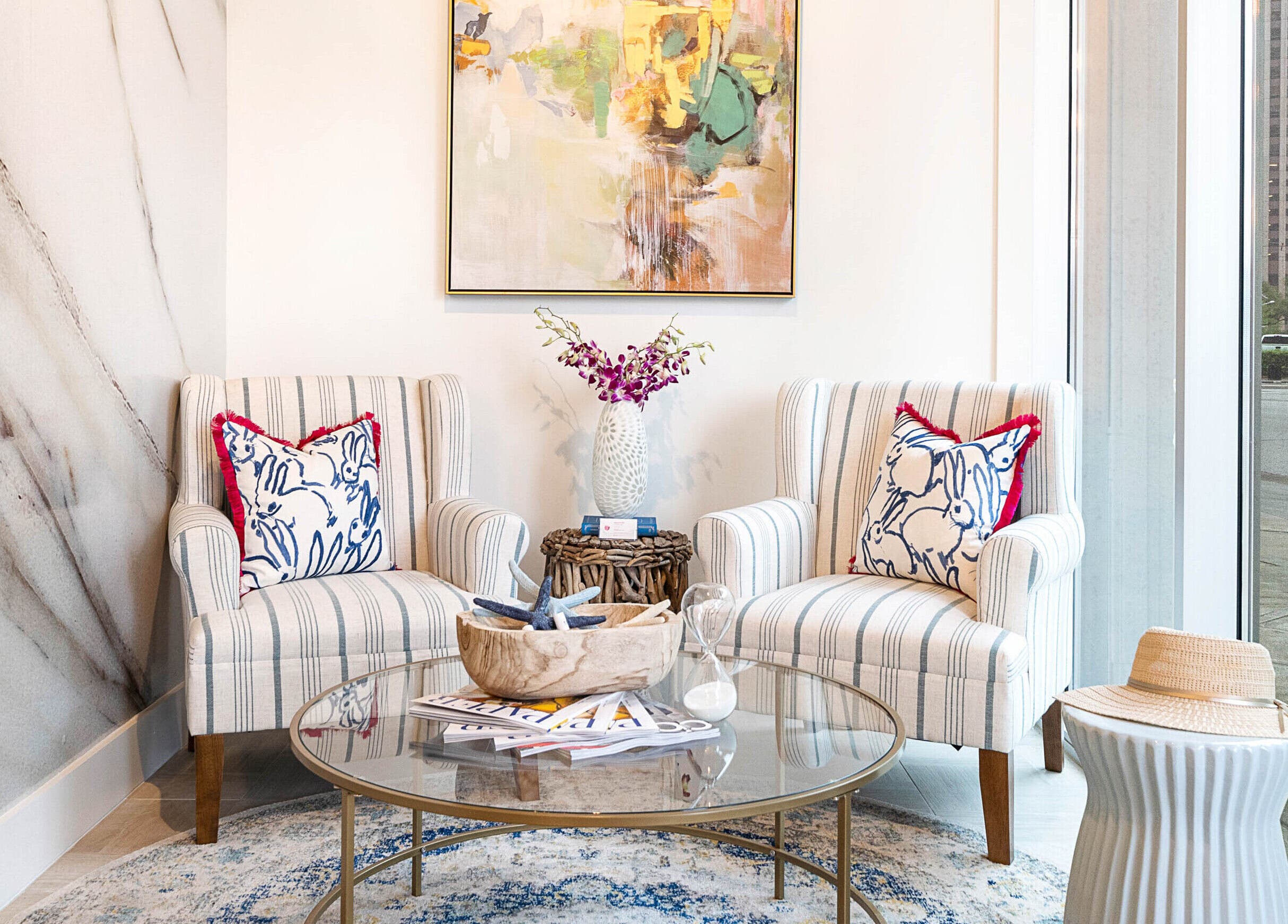 Elegant lounge area at Sojourn De Nails in Houston, Texas, US with stylish chairs and decor.