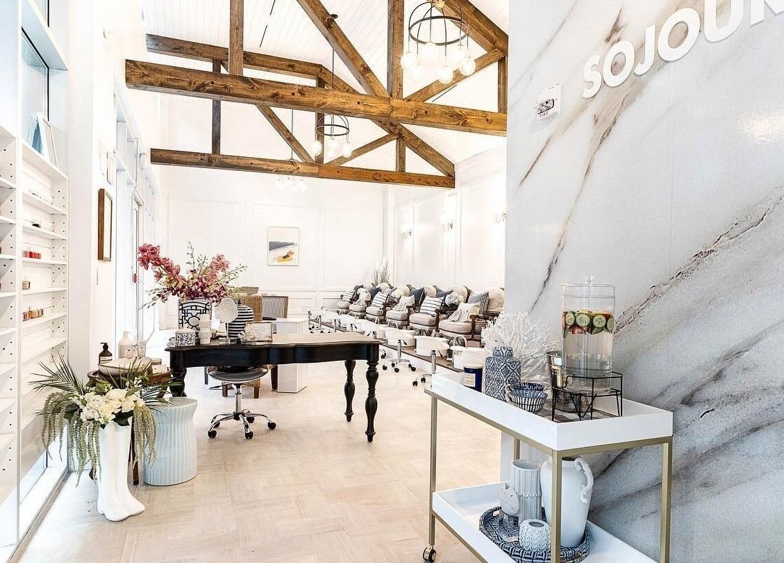 Chic interior of Sojourn De Nails, Houston, Texas, US, featuring stylish seating and modern decor.