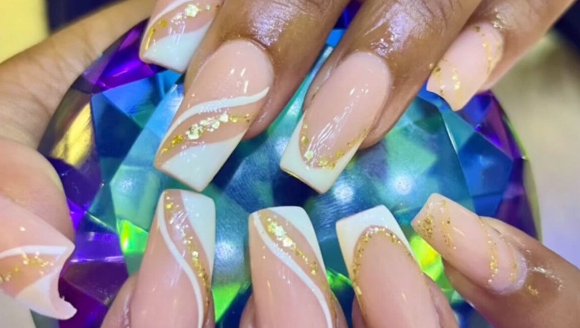 Elegant nail art at Lifestyle on Location - Midrand, Midrand, Gauteng, ZA, showcasing gold accents and a gem.