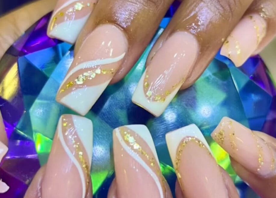 Elegant nail art at Lifestyle on Location - Midrand, Midrand, Gauteng, ZA, showcasing gold accents and a gem.