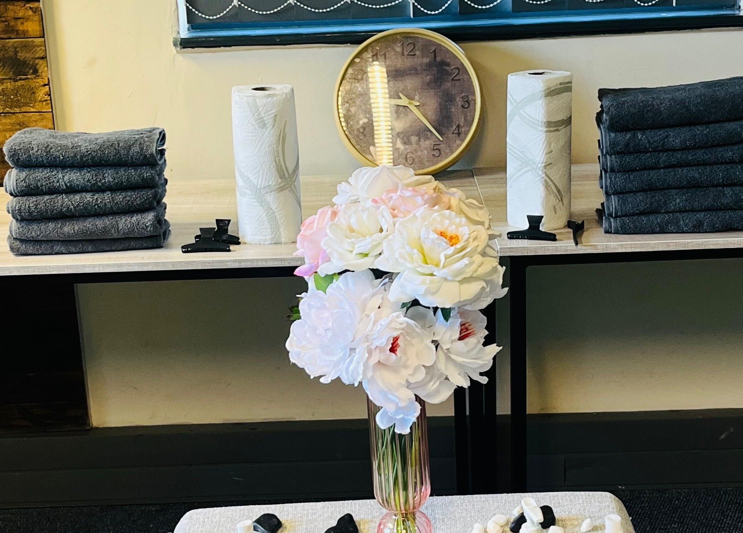 Elegant spa setup at Lifestyle on Location - Midrand, featuring towels and flowers in Midrand, Gauteng, ZA.