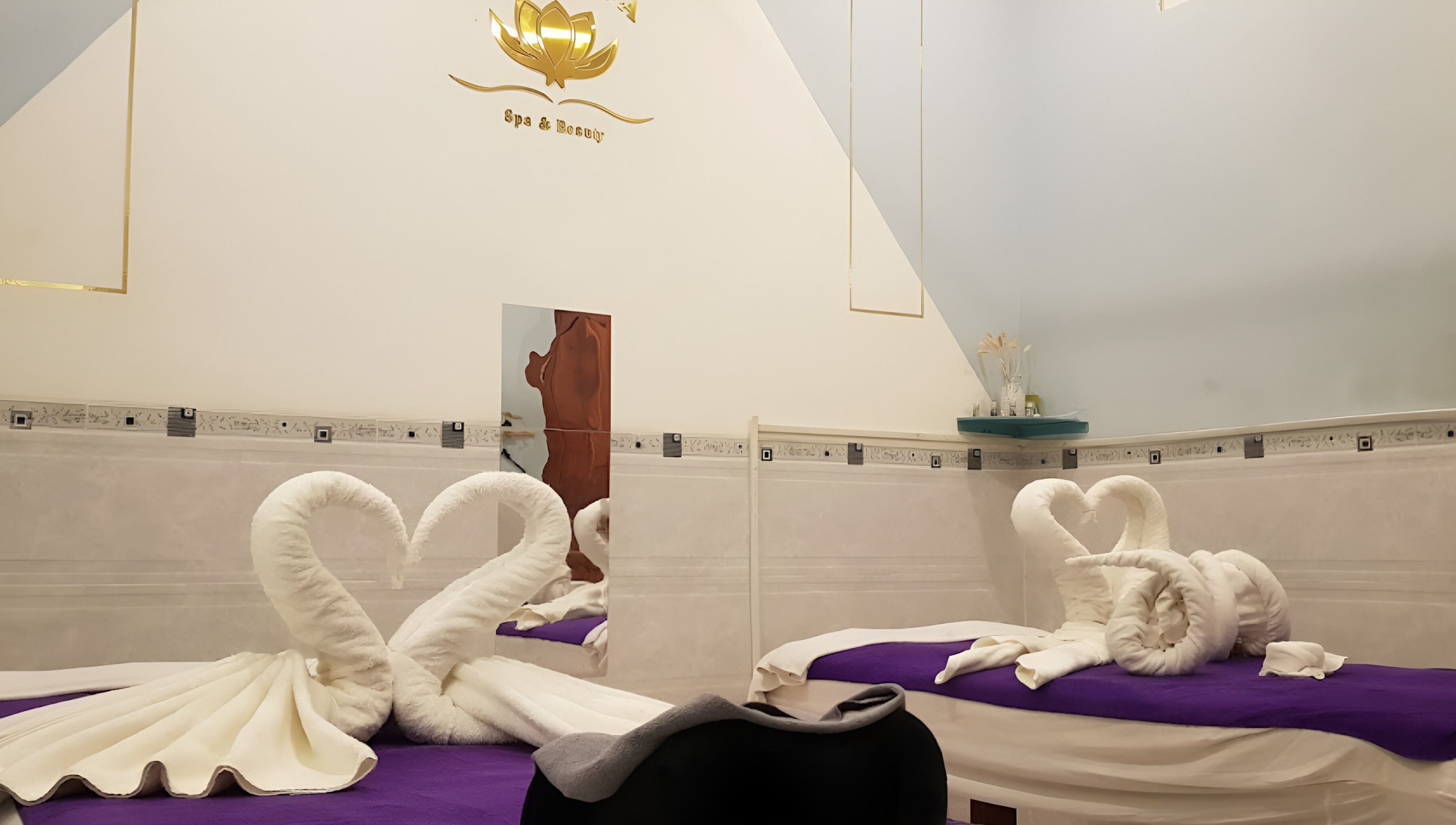 Elegant massage room at Lotus Spa 1, Thành phố Phú Quốc, Kiên Giang, VN with towel swans on beds.