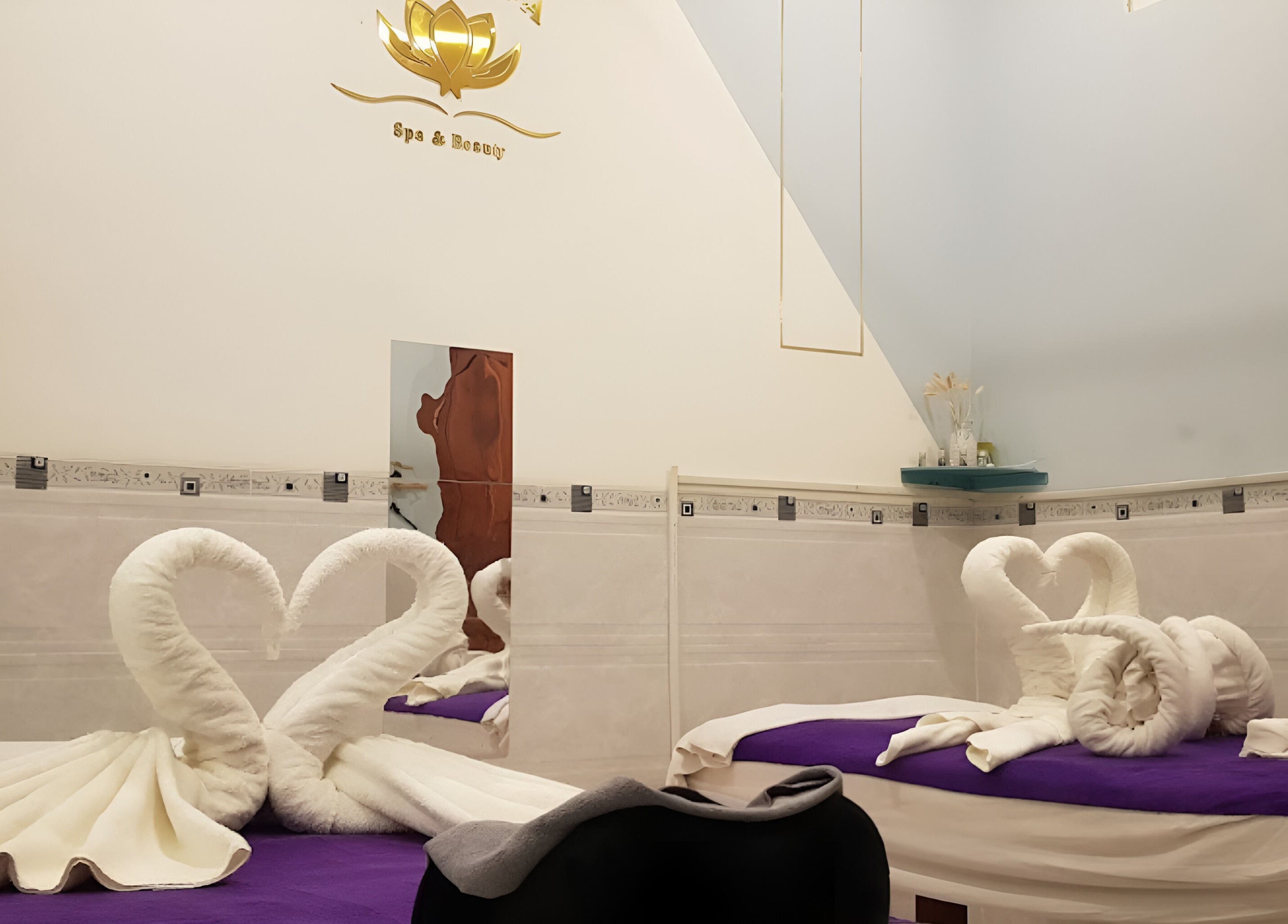 Elegant massage room at Lotus Spa 1, Thành phố Phú Quốc, Kiên Giang, VN with towel swans on beds.