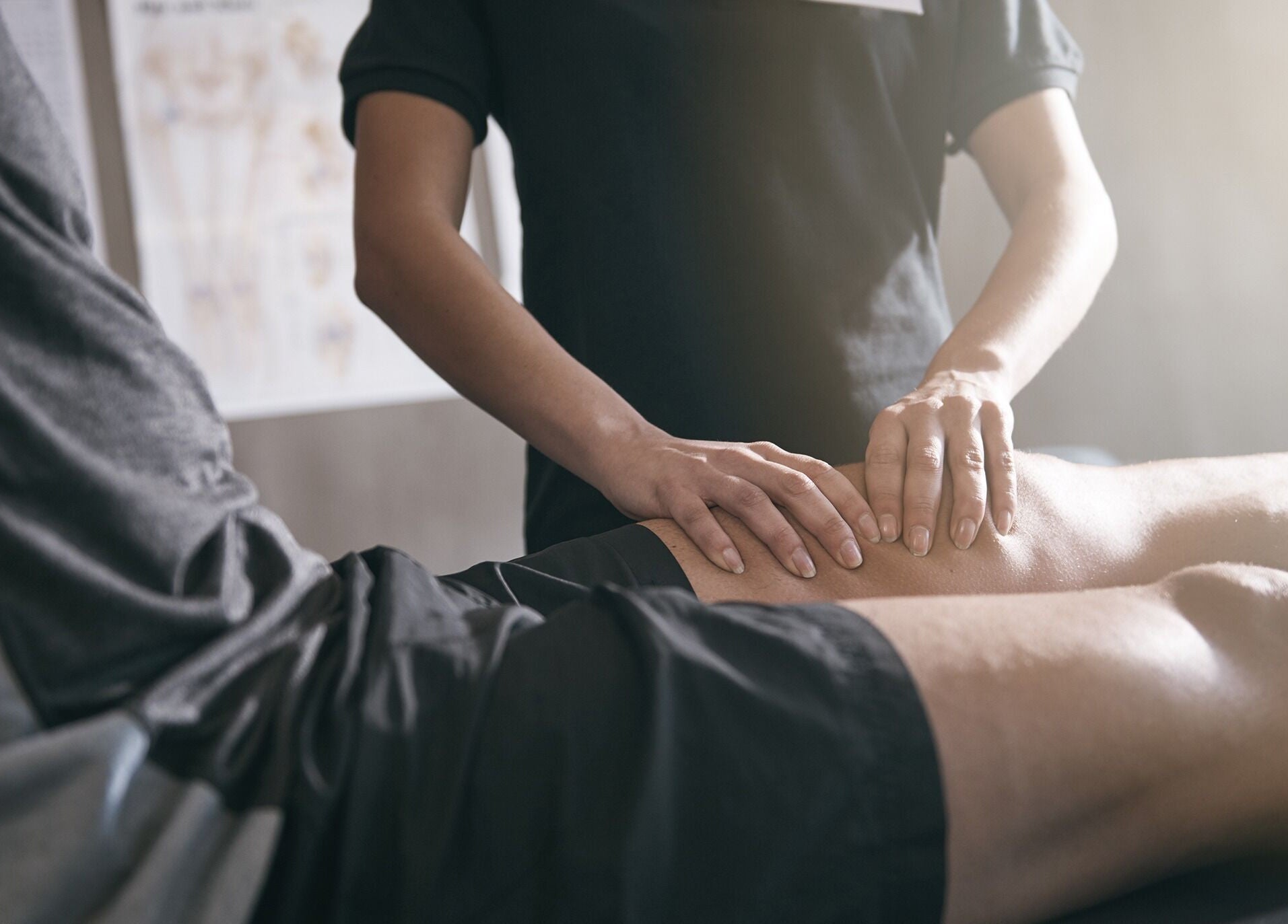 Therapist performing knee treatment at Capital Peak Performance Weston, Weston, ACT, AU.