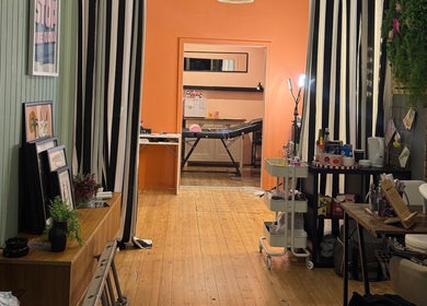 Calm interior of Peak Physique and Bodywork Kirkcaldy, Scotland, GB showcasing a massage table and decor.