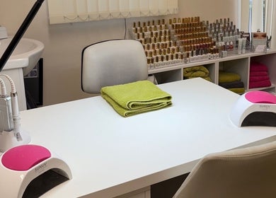 Manicure station at Beauty by Tracy Polak in Eakring, England, GB with tools and nail polish bottles displayed.