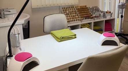 Manicure station at Beauty by Tracy Polak in Eakring, England, GB with tools and nail polish bottles displayed.