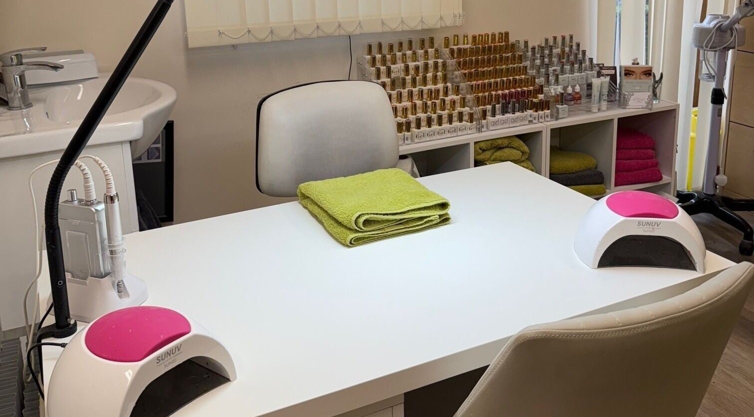 Manicure station at Beauty by Tracy Polak in Eakring, England, GB with tools and nail polish bottles displayed.