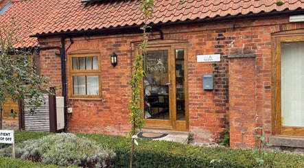 Beauty by Tracy Polak entrance, a cozy brick building in Eakring, England, GB.