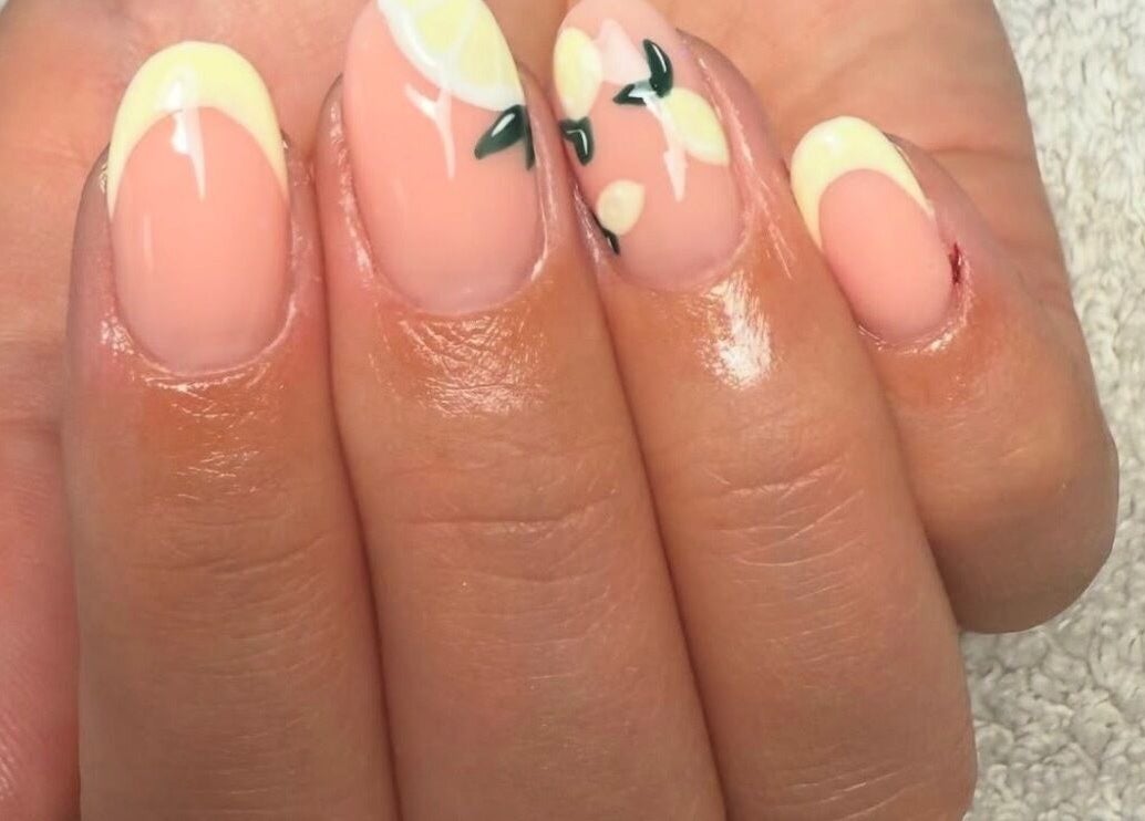 Elegant lemon-themed nail art at Beauty by Shelli in Howden, England, GB. Perfect for a summer vibe.