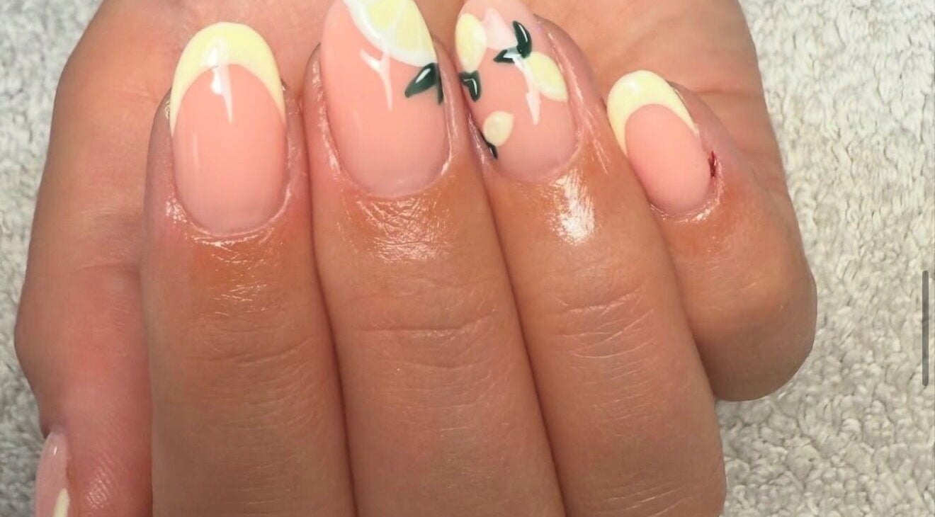 Elegant lemon-themed nail art at Beauty by Shelli in Howden, England, GB. Perfect for a summer vibe.