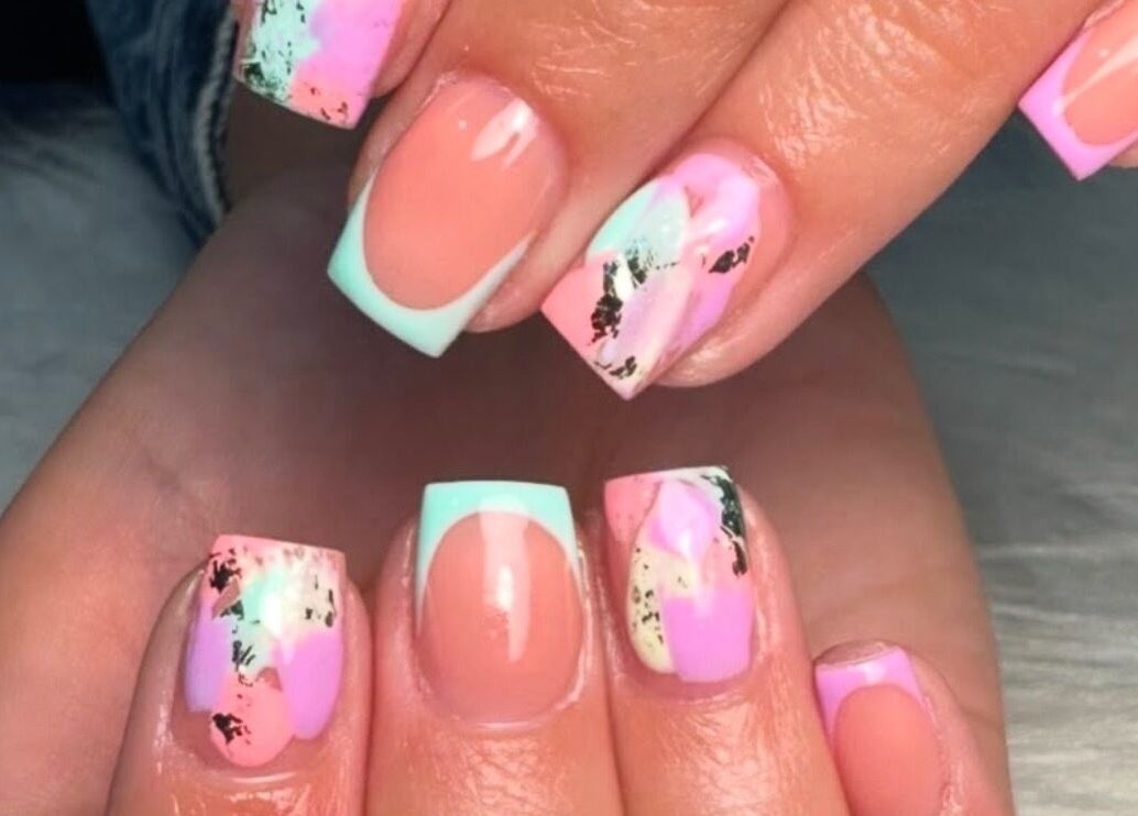 Vibrant nail art at Beauty by Shelli in Howden, England, GB, featuring pink and mint designs.