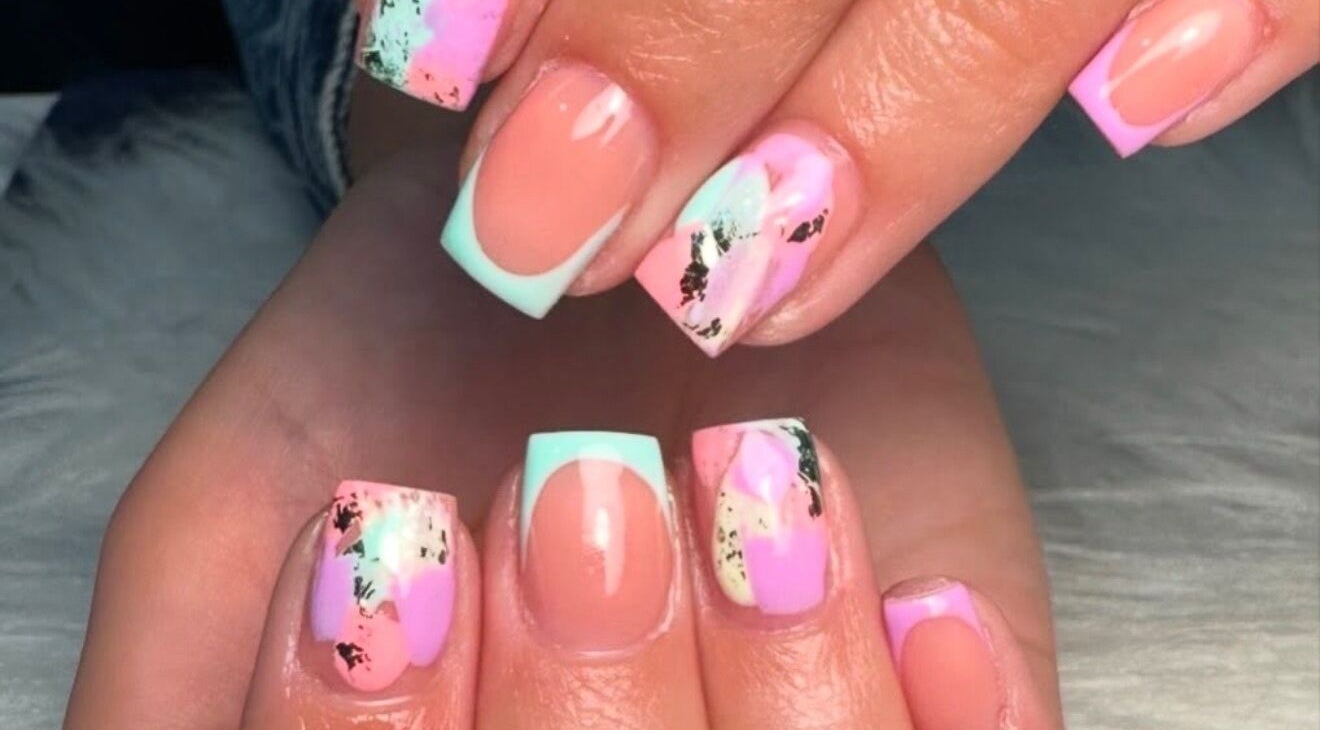 Vibrant nail art at Beauty by Shelli in Howden, England, GB, featuring pink and mint designs.