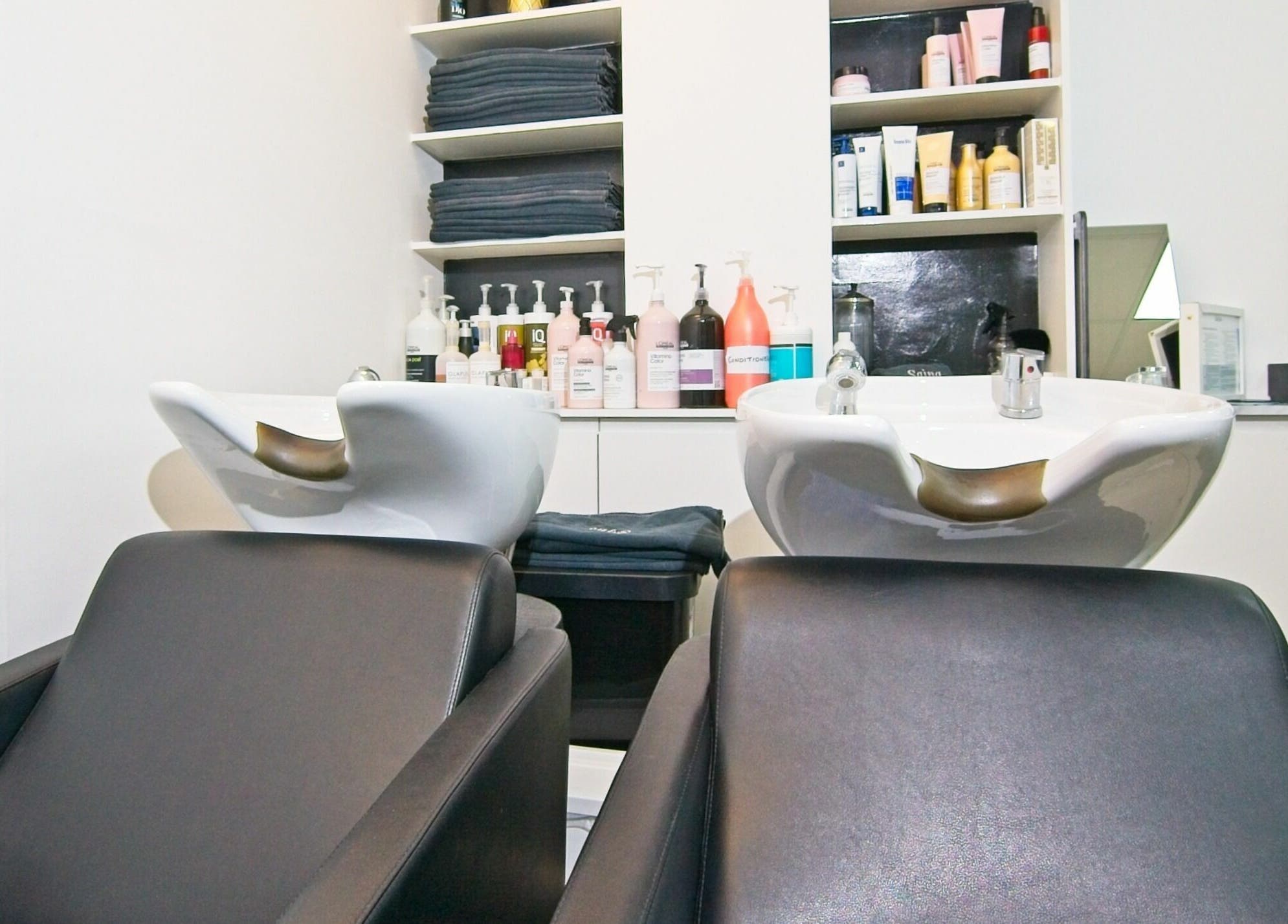 Luxurious wash stations at Sajna Hair & Beauty, Wimbledon in London, England, GB, exuding elegance and comfort.