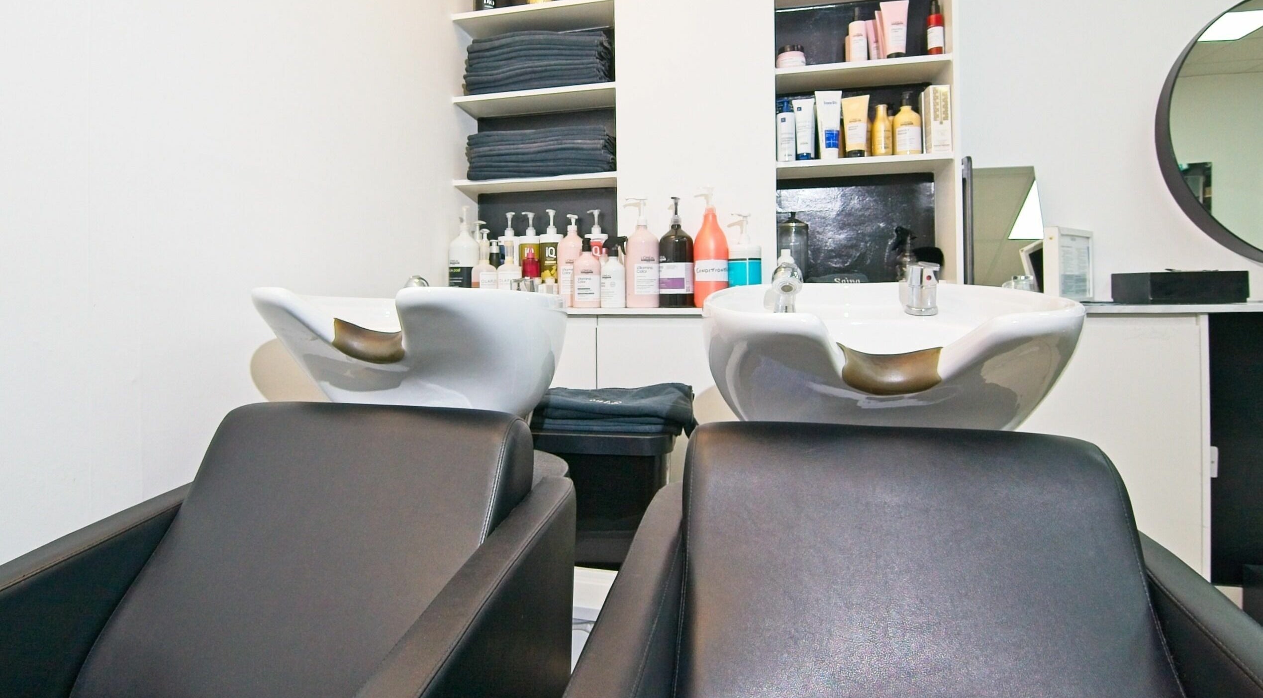 Luxurious wash stations at Sajna Hair & Beauty, Wimbledon in London, England, GB, exuding elegance and comfort.