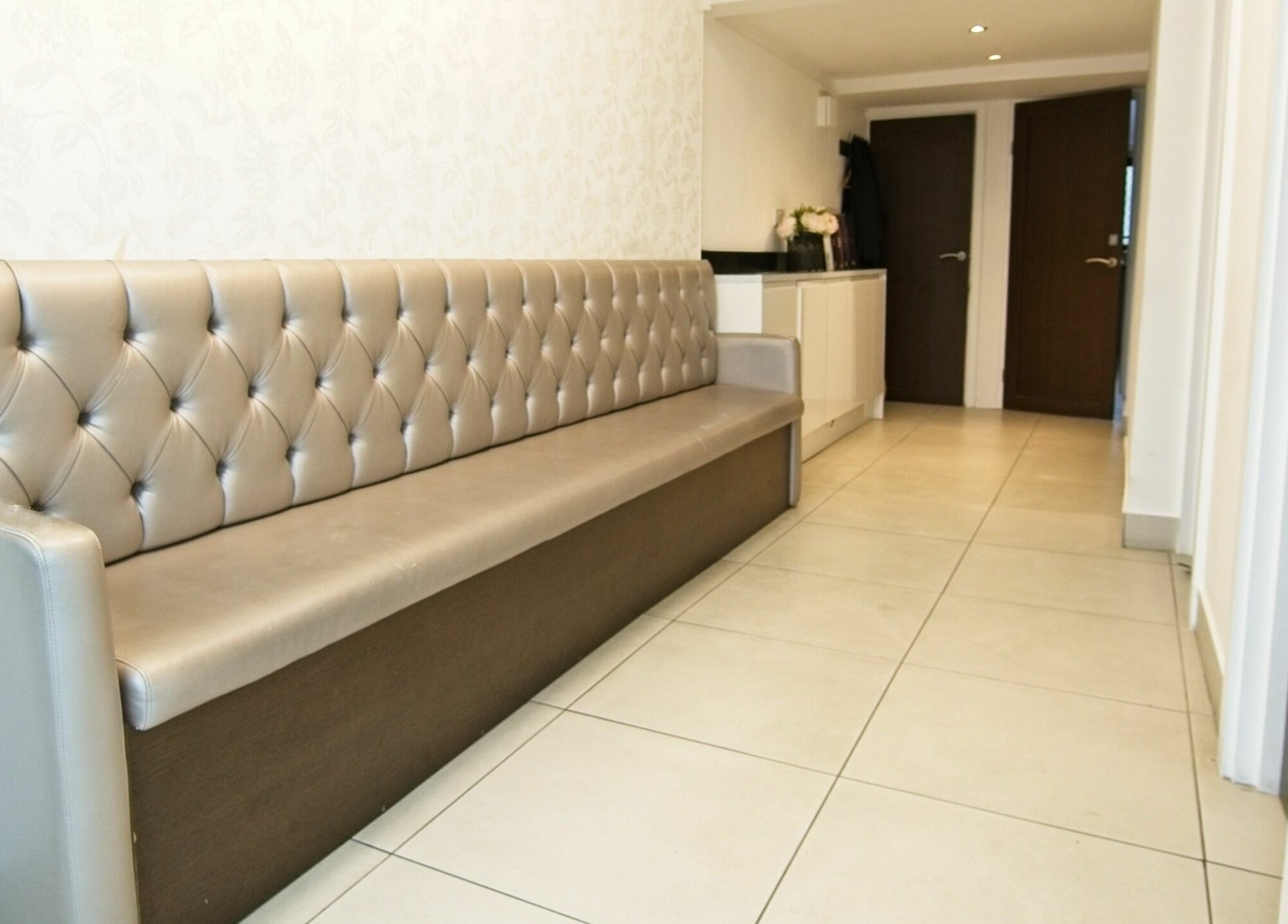 Chic lobby at Sajna Hair & Beauty, Wimbledon with a modern bench, located in London, England, GB.