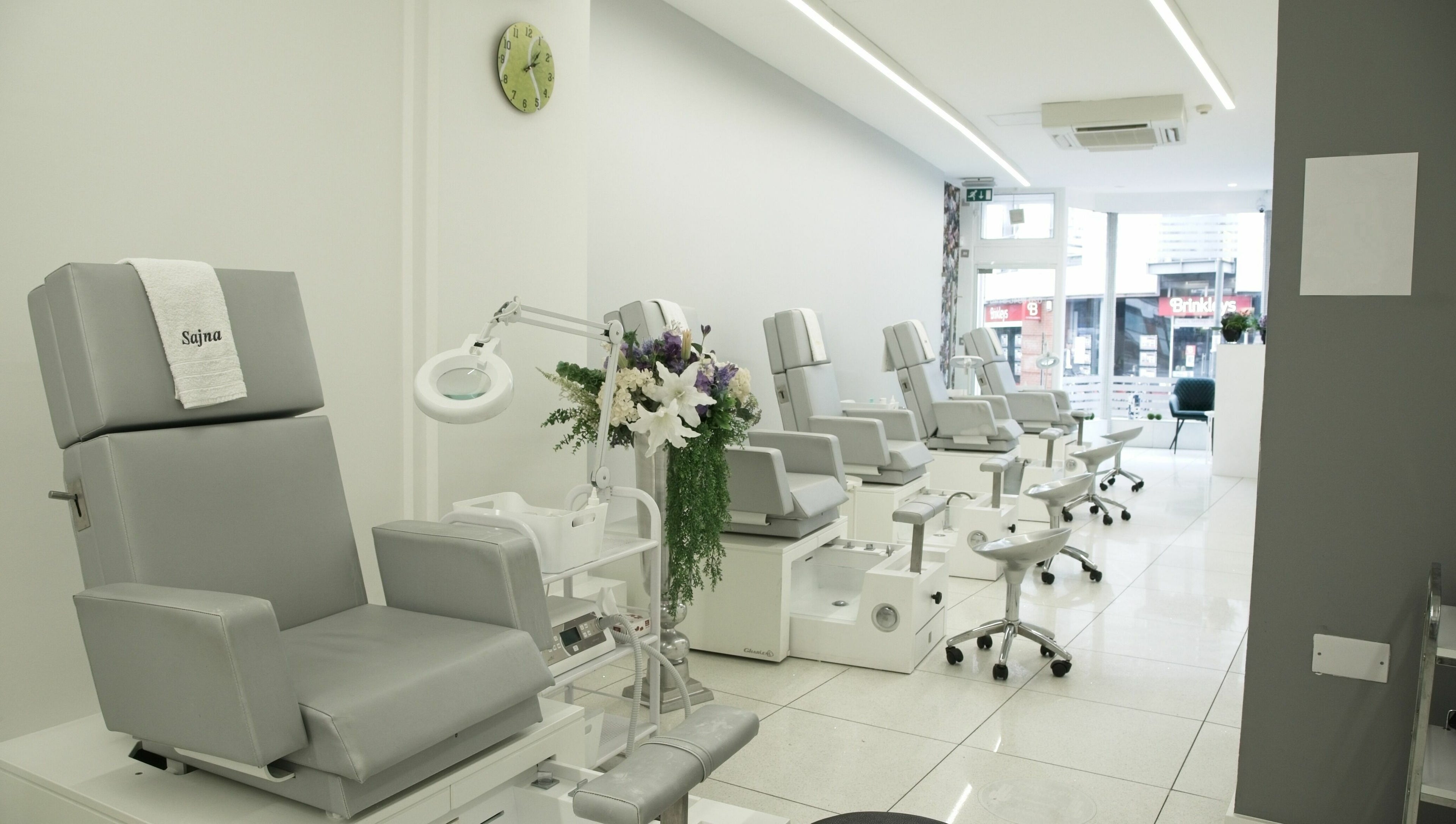 Elegant spa chairs at Sajna Hand & Foot Spa, Wimbledon, London, England, GB, offering comfort and relaxation.