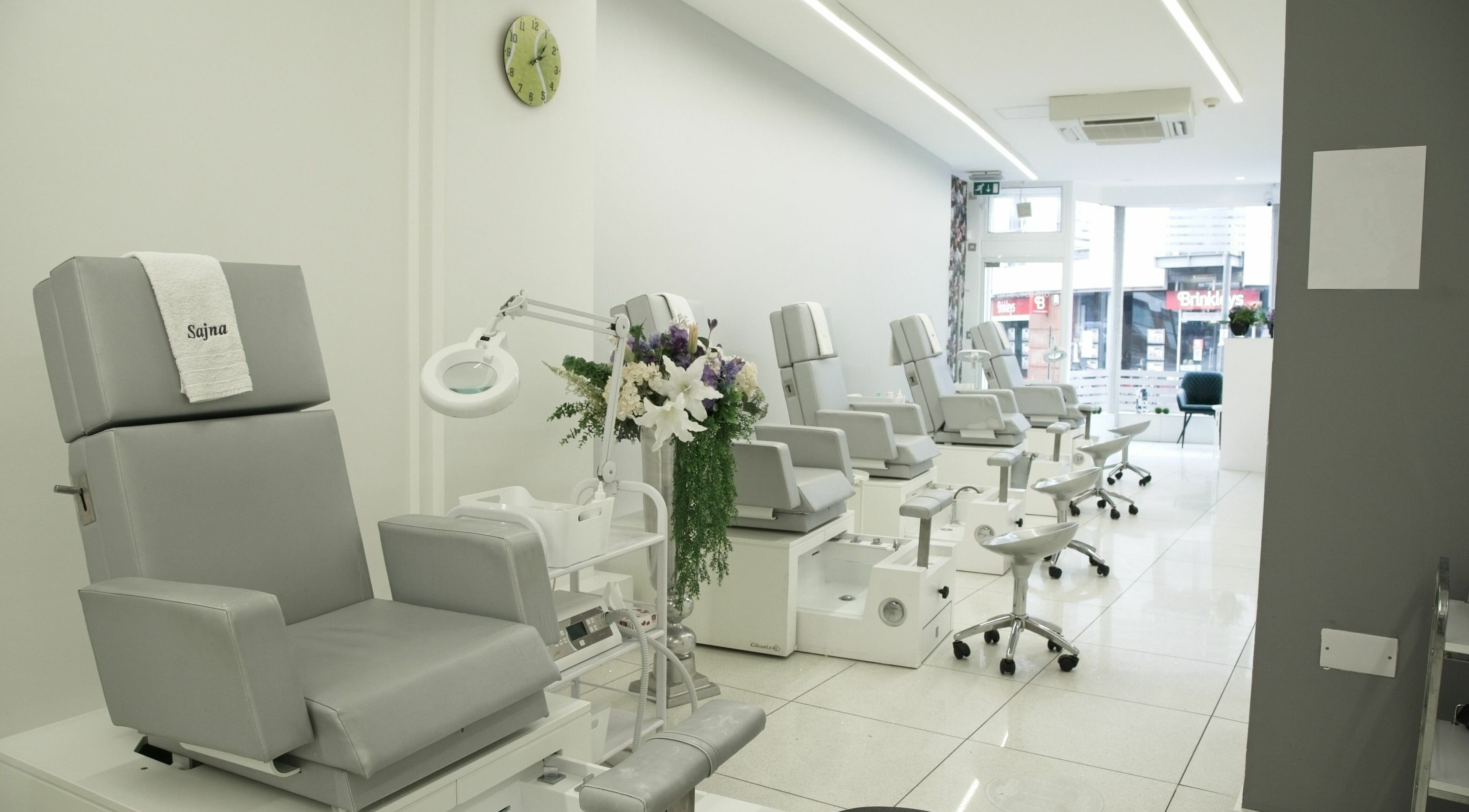 Elegant spa chairs at Sajna Hand & Foot Spa, Wimbledon, London, England, GB, offering comfort and relaxation.