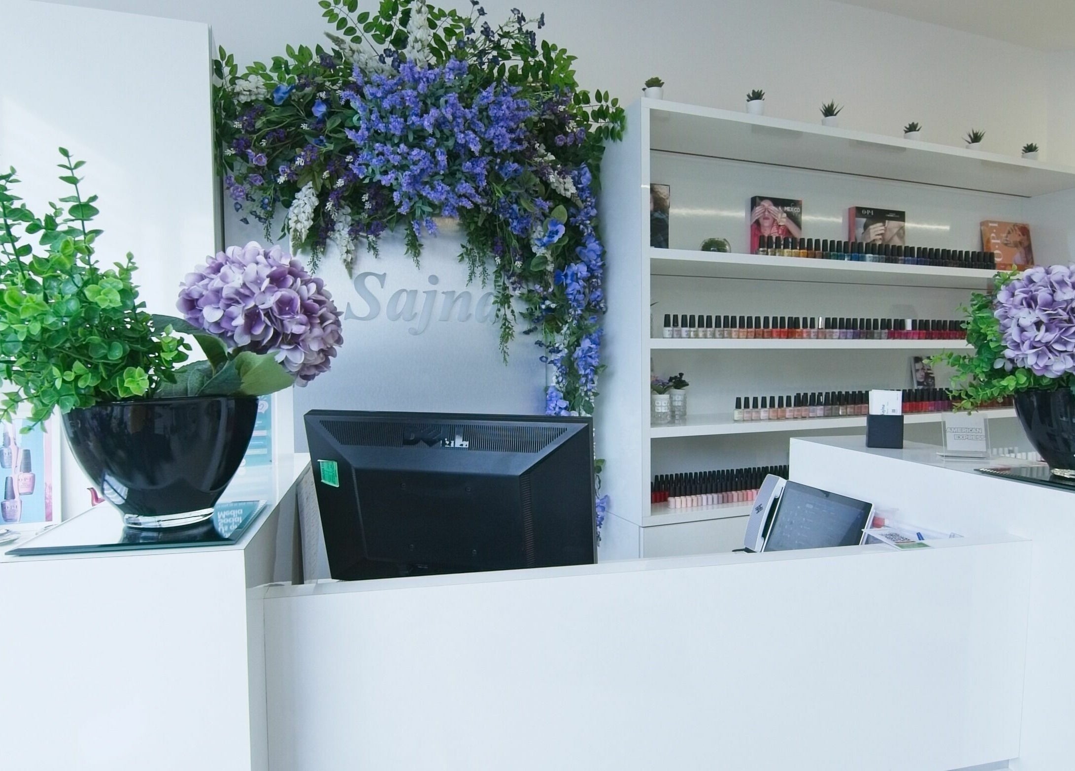 Reception at Sajna Hand & Foot Spa, Wimbledon, showcasing lush flowers in London, England, GB.