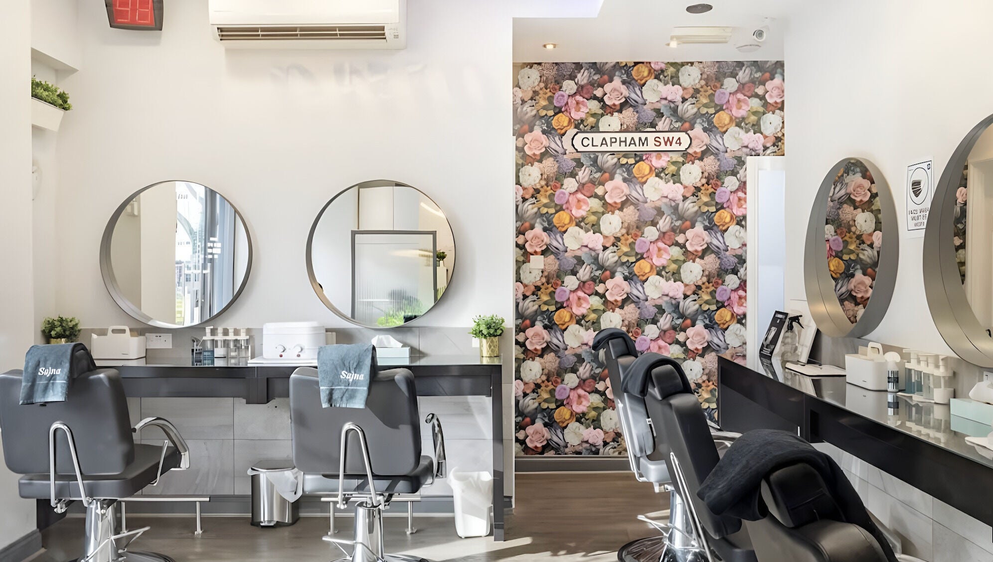 Elegant interior of Sajna Beauty Spa Clapham with floral decor and modern styling chairs in London, England, GB.