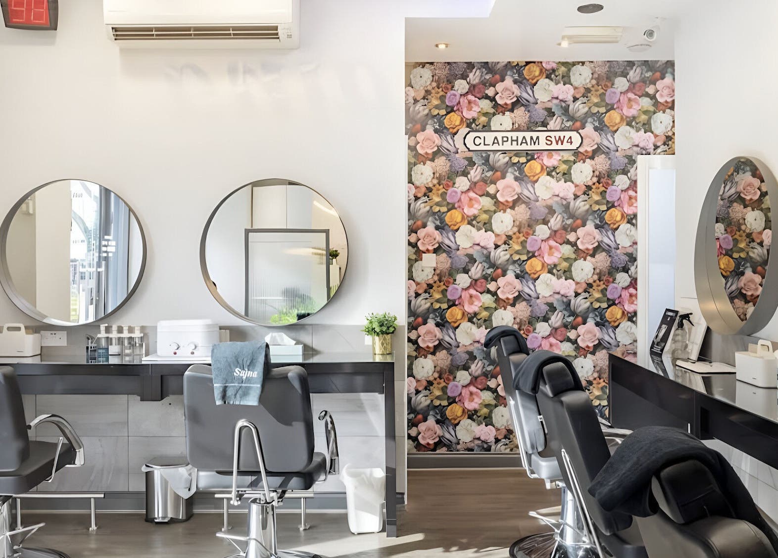 Elegant interior of Sajna Beauty Spa Clapham with floral decor and modern styling chairs in London, England, GB.