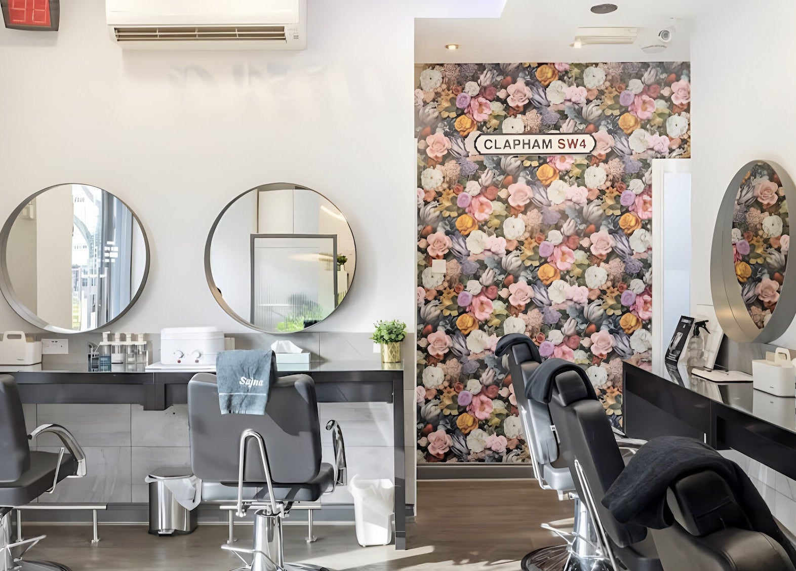 Elegant interior of Sajna Beauty Spa Clapham with floral decor and modern styling chairs in London, England, GB.