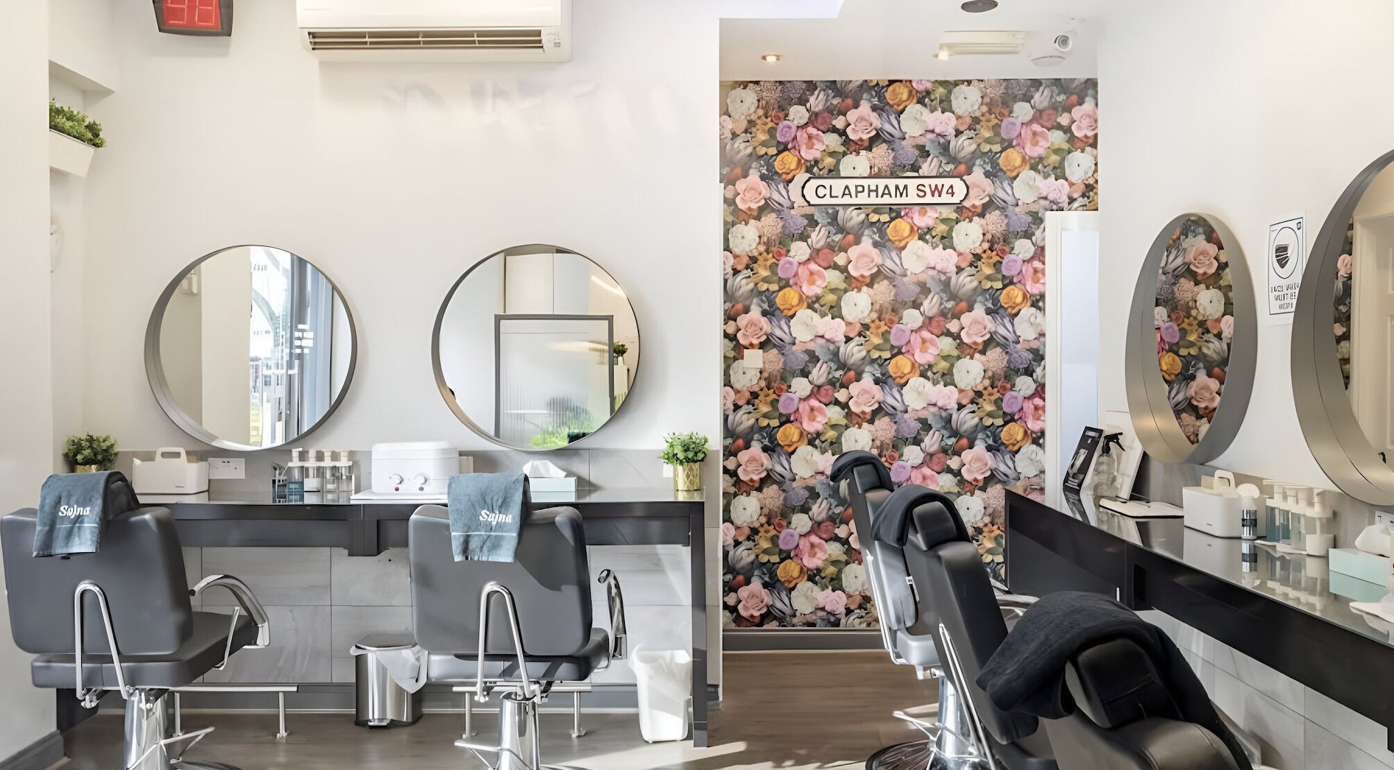 Elegant interior of Sajna Beauty Spa Clapham with floral decor and modern styling chairs in London, England, GB.