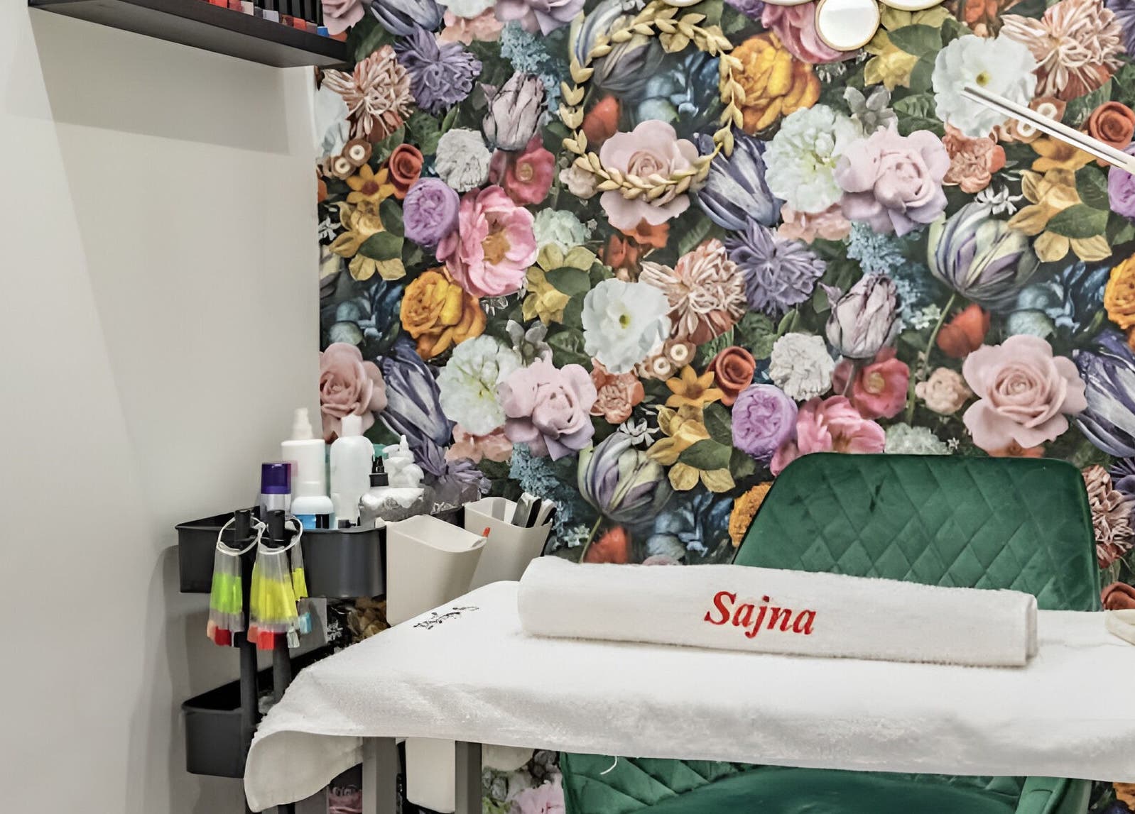 Treatment room at Sajna Beauty Spa Clapham, London, England, GB, with vibrant floral wall design.