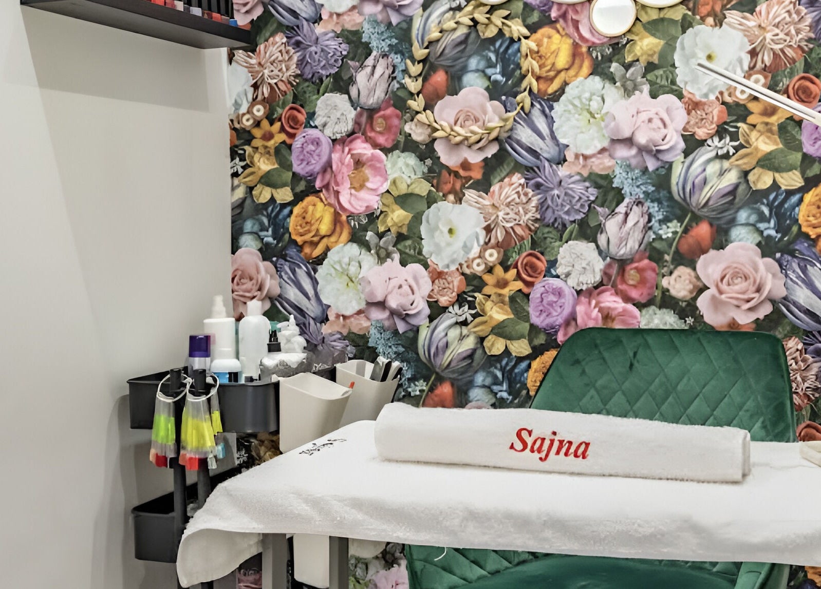 Treatment room at Sajna Beauty Spa Clapham, London, England, GB, with vibrant floral wall design.