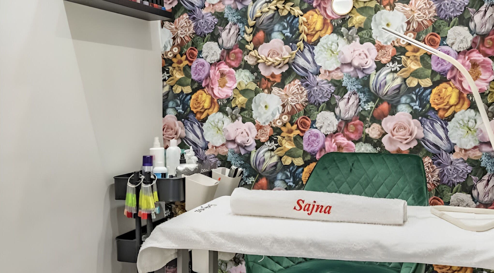 Treatment room at Sajna Beauty Spa Clapham, London, England, GB, with vibrant floral wall design.