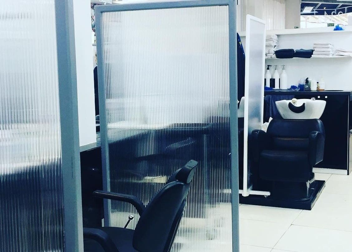 Modern salon interior at Sajna Beauty Spa Clapham, London, England, GB featuring sleek styling chairs.