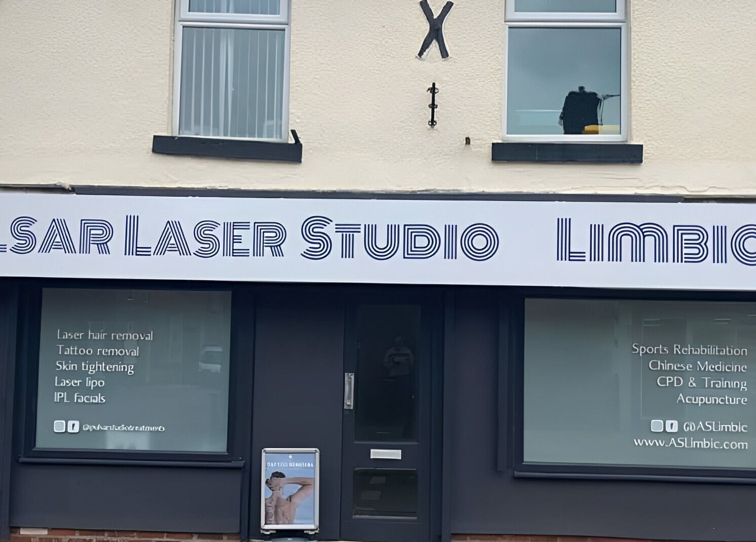 Exterior view of Pulsar Laser Studio in Bolton, England, GB, highlighting services like tattoo removal and skin tightening.