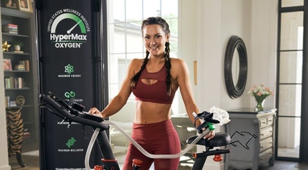 Woman using a HyperMax Oxygen bike at Alfred's Wellness, Willowbrook, Illinois, US.