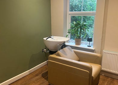 Elegant wash station at The Salon At Twenty Four, Woodford Halse, England, GB, with green accents.