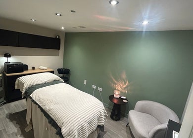 Relaxing treatment room at The Salon At Twenty Four, Woodford Halse, England, GB, with soothing decor.