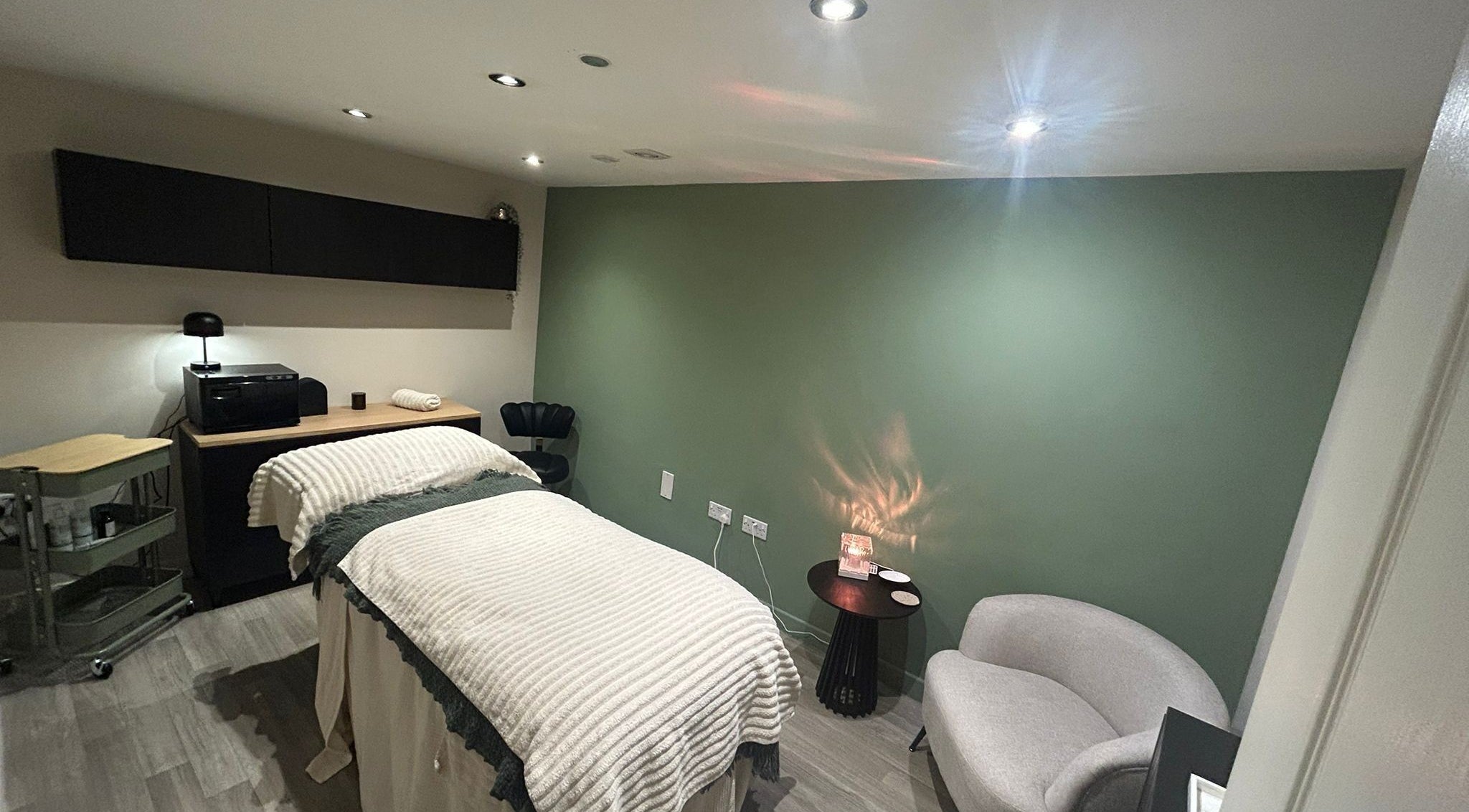 Tranquil spa room at The Salon At Twenty Four, Woodford Halse, England, GB, featuring a cozy treatment bed.
